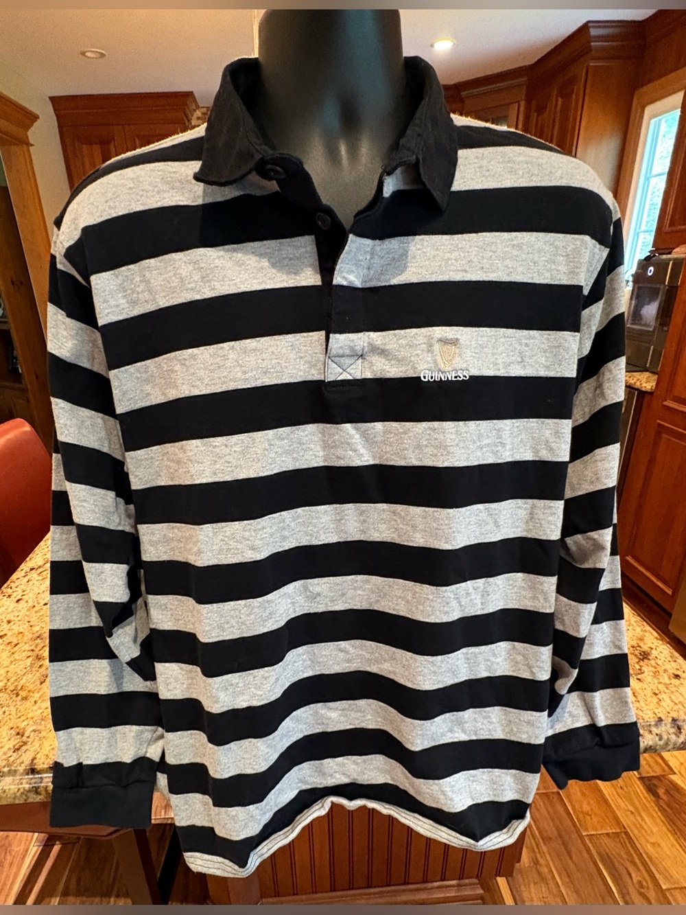 Guinness Rugby men’s polo Shirt. Sharp black/white stripes with logo. Large